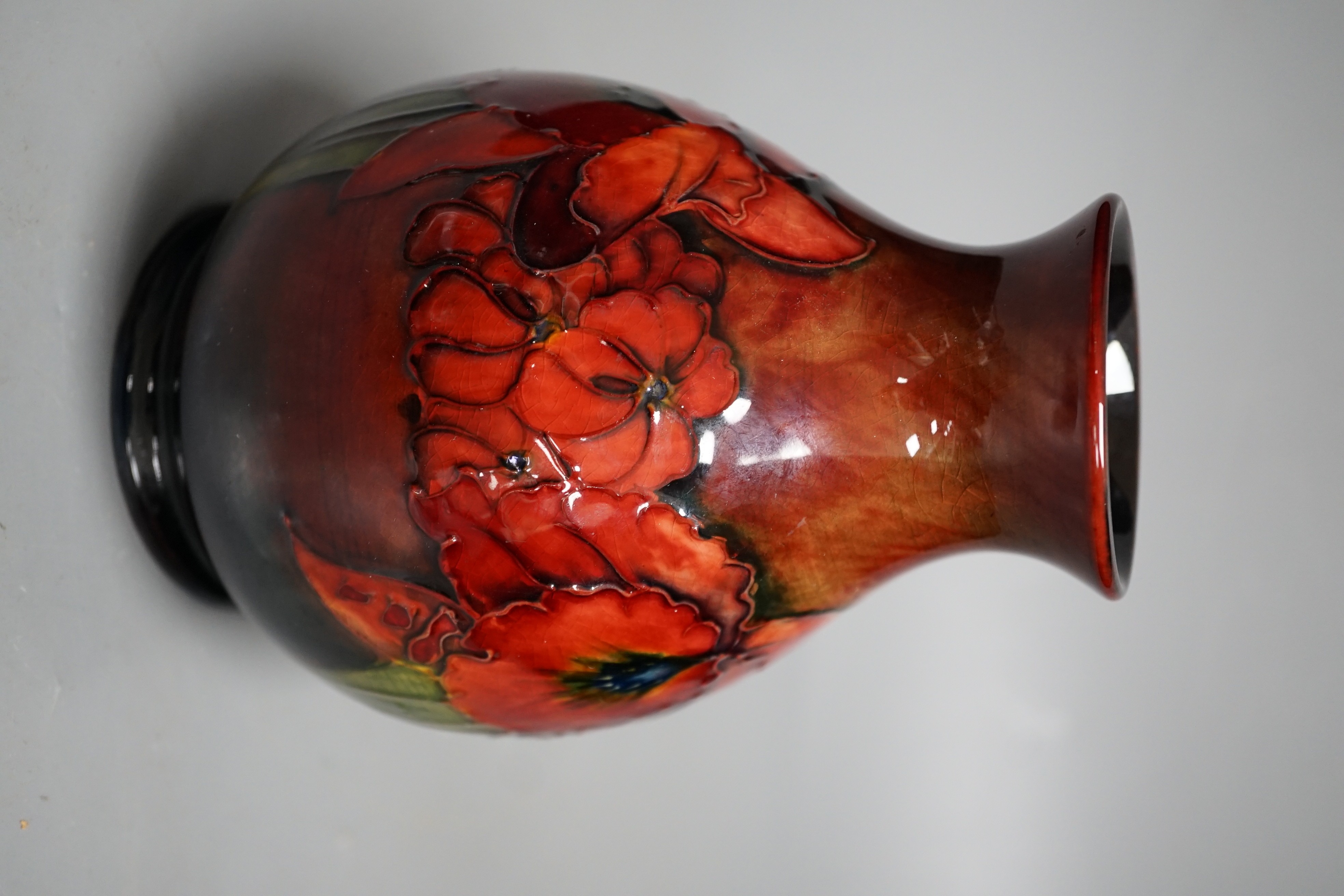 A Moorcroft flambé orchid pattern vase, 15cm